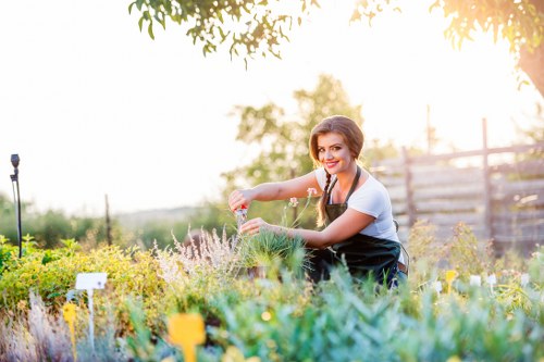 Front view of a gardener starting work in a residential garden
