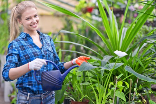 Gardener with tablet confirming secure payment