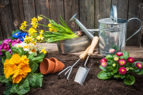 Technician inspecting and maintaining gardening machinery